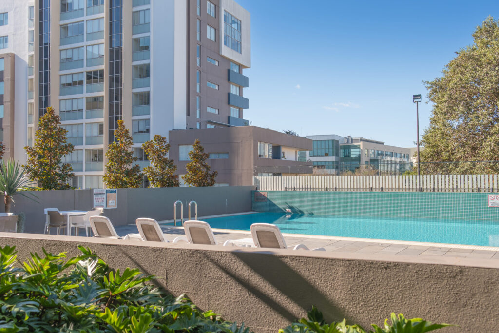 Honeysuckle Executive Apartments outdoor pool and building facade