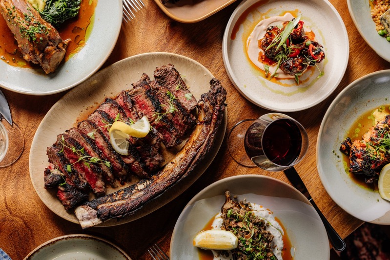 Grilled steak and gourmet dishes served near Honeysuckle Apartments Newcastle dining options.